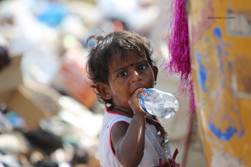 child_drinking_water_madras_courier