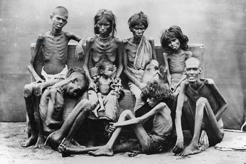 A photograph of emaciated people, suffering of starvation during the Madras...