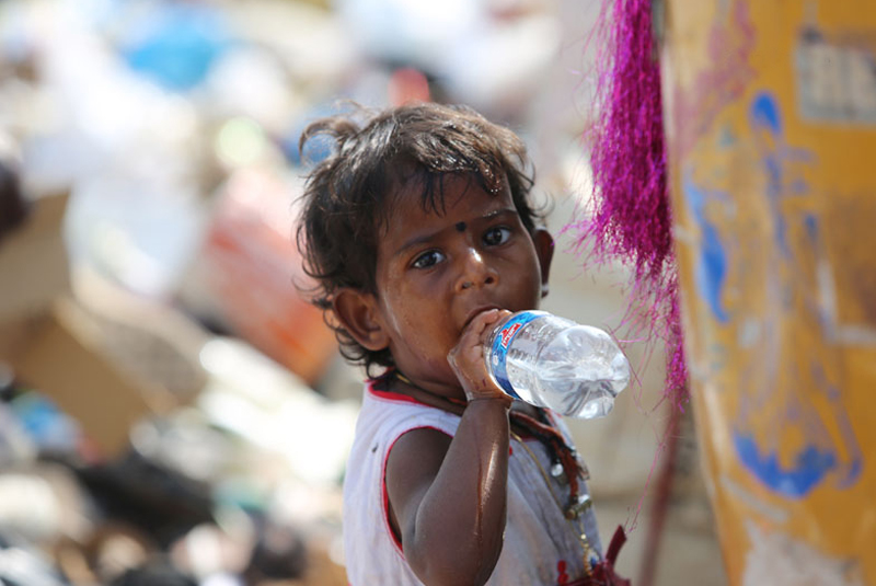 child_drinking_water_madras_courier